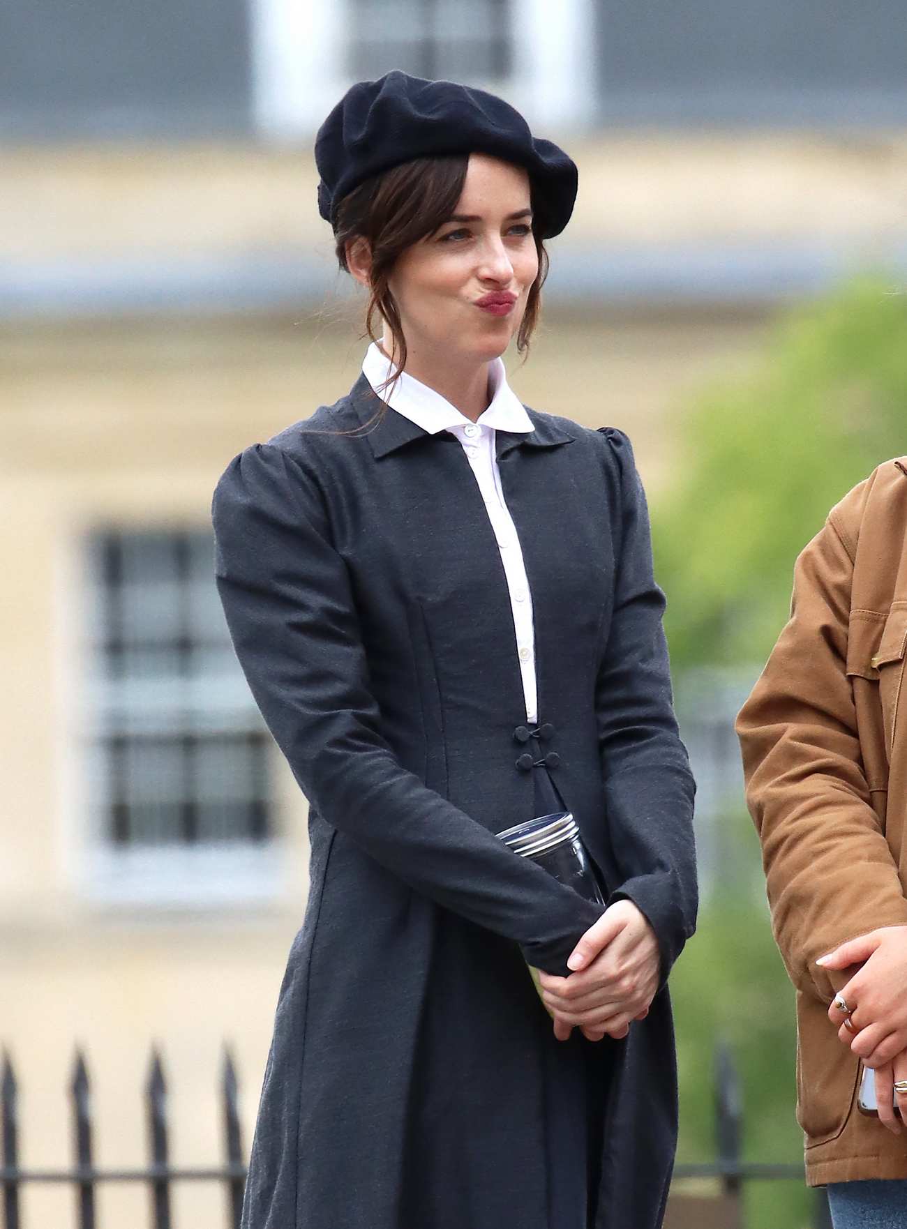 Dakota_Johnson_-_On_the_set_of__Persuasion__on_The_Royal_Crescent_In_Bath2C_UK_06242021_21.jpg