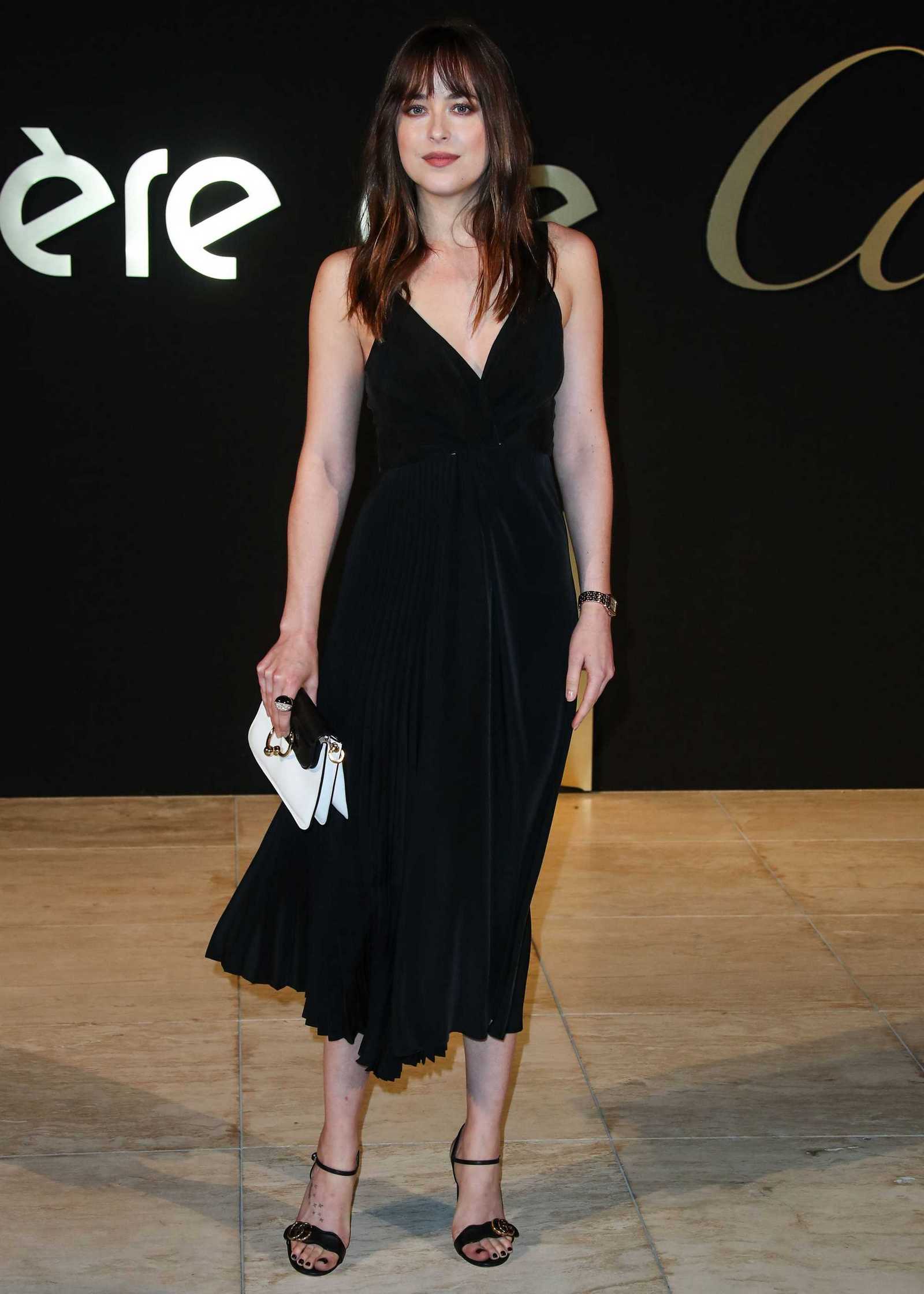 Dakota_Johnson_-_Panthere_De_Cartier_Party_In_LA_on_May_5-61.jpg