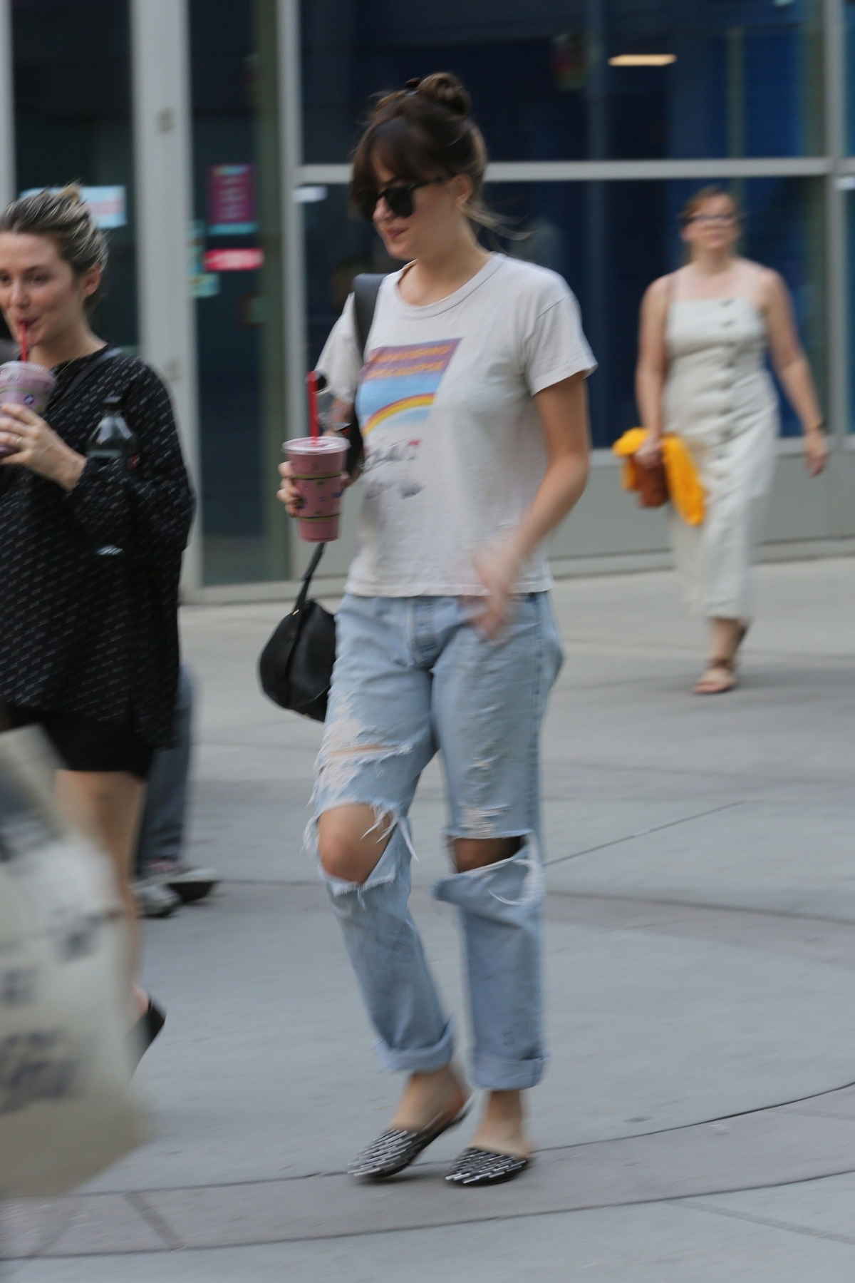 Dakota_Johnson_-_at_the_Arclight_Cinemas_with_her_friend_Addison_Timlin_in_Hollywood_-_July_600010.jpg
