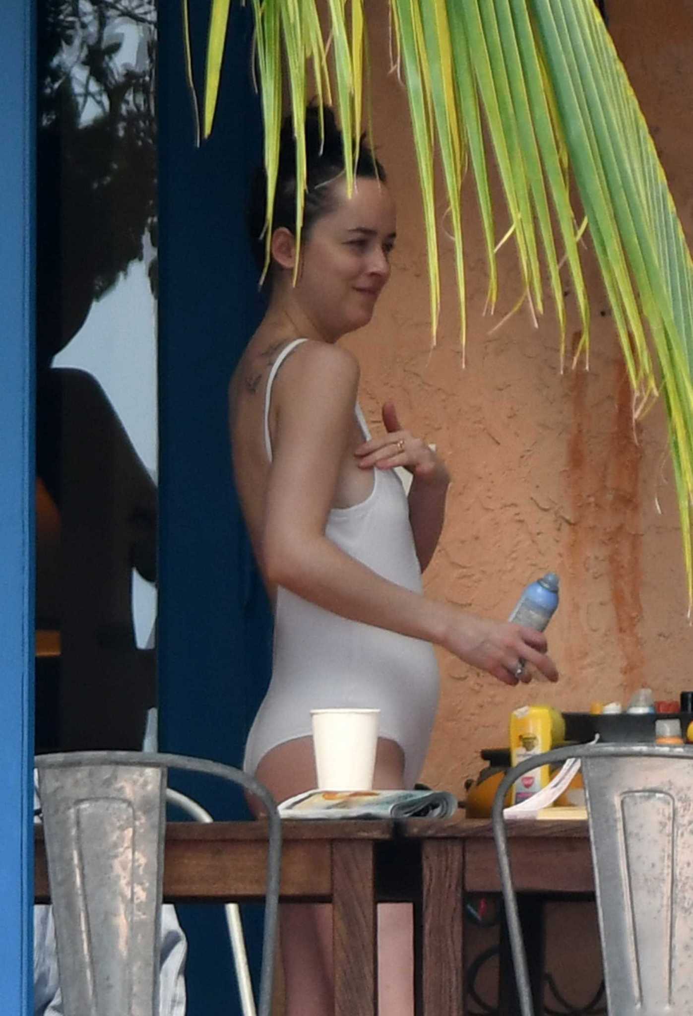 Dakota_Johnson_-_wearing_a_bikini_at_a_beach_in_Miami_on_April_2-11.jpg Dakota_Johnson_-_wearing_a_bikini_at_a_beach_in_Miami_on_April_2-11.jpg