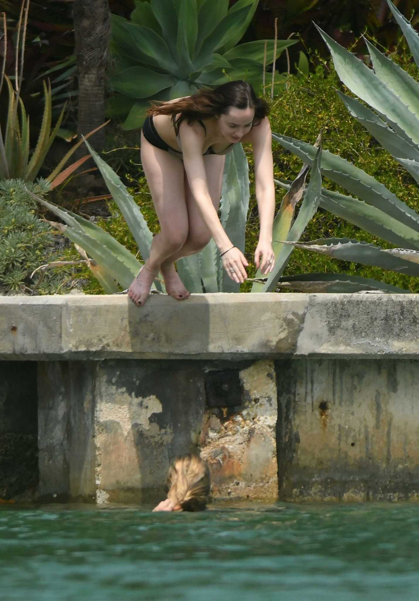 Dakota_Johnson_-_wearing_a_bikini_at_a_beach_in_Miami_on_April_4-34.jpg